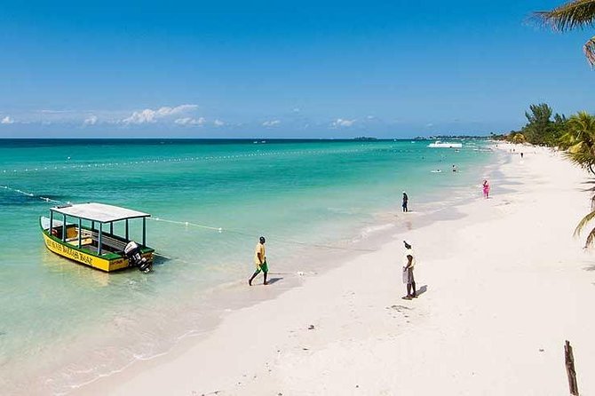 Blue Hole Mineral Spring, Ricks Cafe, 7 Mile Beach and Shopping Private Tour - Time Square Mall: a practical shopping stop