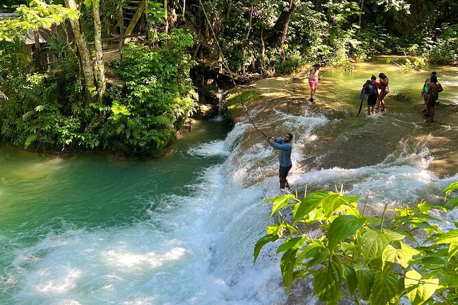 Blue Hole Waterfalls and Bamboo Rafting with Transportation - The driver is part of the experience