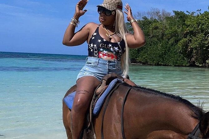 Dunn’s River Falls,Zip lining & horseback riding Combo tour from Montego Bay - Climbing Dunn’s River Falls with a guide