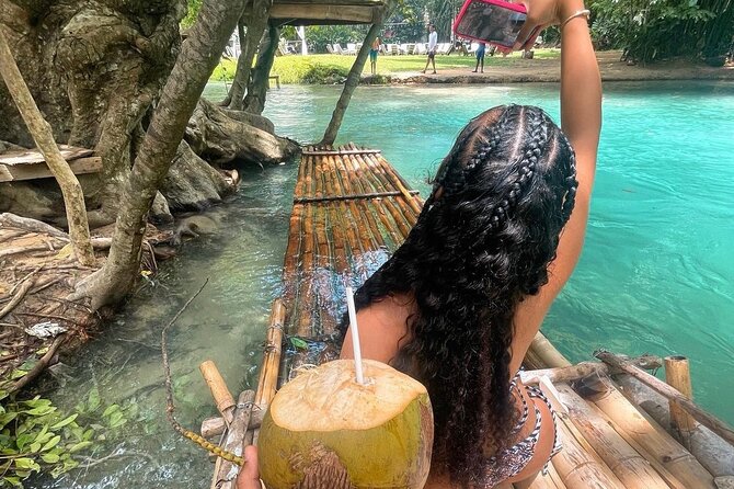 Dunns River Falls, Zipline, Bamboo Rafting, Horseback Ride Tour - Riding a horse into the Caribbean Sea