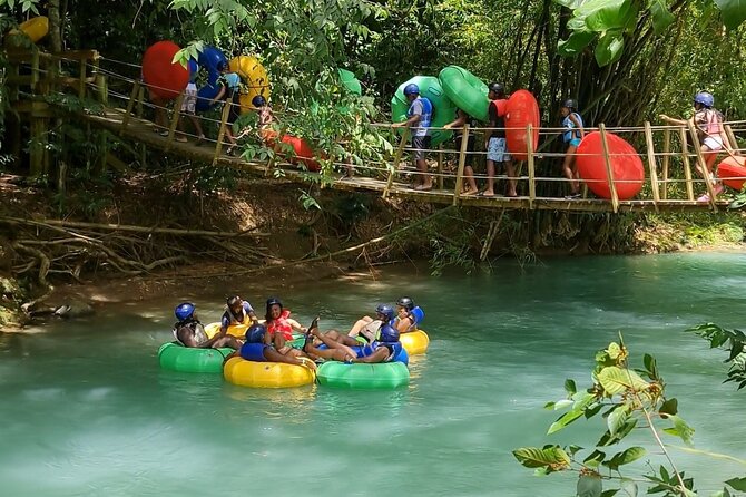 Falmouth Waterfalls River Tubing and Beach Adventure - Tubing the Rio Bueno through gentle rapids