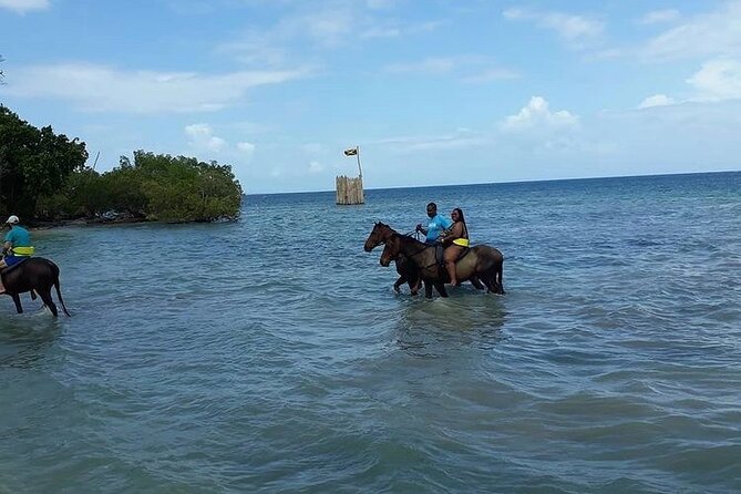 Horseback Riding, ATV and Ocean Zip lining combo from Montego Bay - Riding into the Caribbean Sea at Sandy Bay