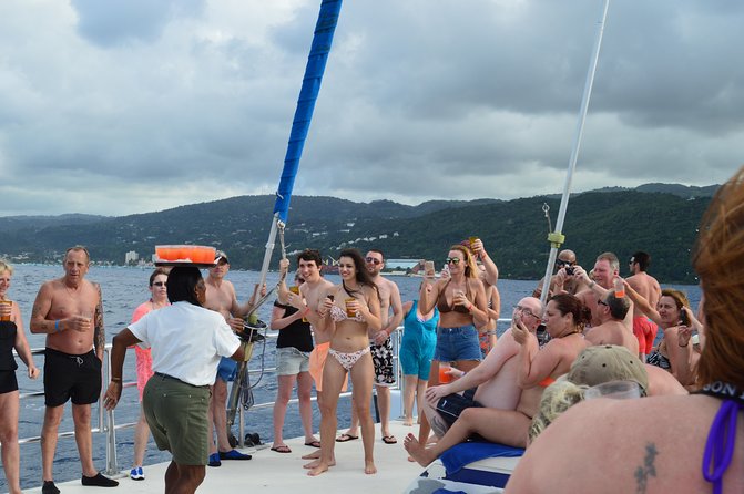 Jamaica Dunn's River Falls Party Cruise with Snorkeling - Food, drinks, music, and the party mood