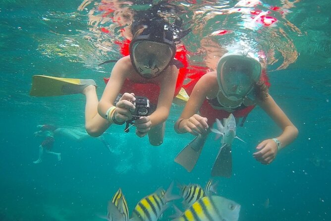 Montego Bay Catamaran: Snorkel Tour with Open Bar & Reggae DJ - Jamaican dance lessons before the ride back