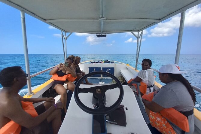 Negril Glass Bottom Boat Tour Snorkeling and Booby Cay - Booking, cancellation, and weather details