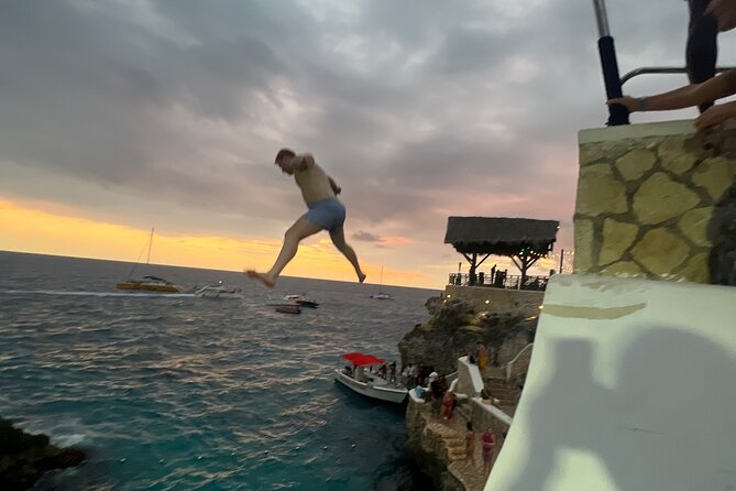 Negril Private Day Tour: ATV Ride, Party Catamaran & Ricks Cafe - Rick’s Cafe, cliff jumps, and the sunset finish