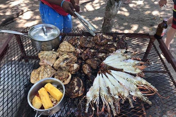 Negril Ricks cruise PLUS Booby Cay Lobster & Cave Snorkeling - Arriving at Rick’s Cafe by boat