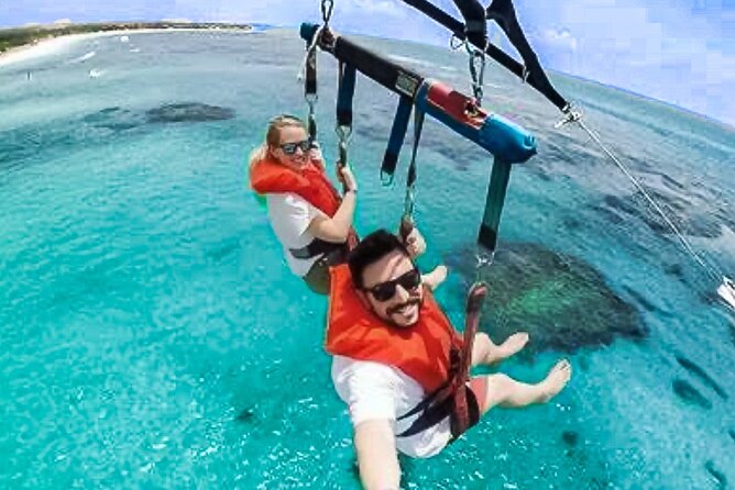 Parasailing above Turquoise Ocean Waters in Montego Bay - Why See Montego Bay From the Sky?