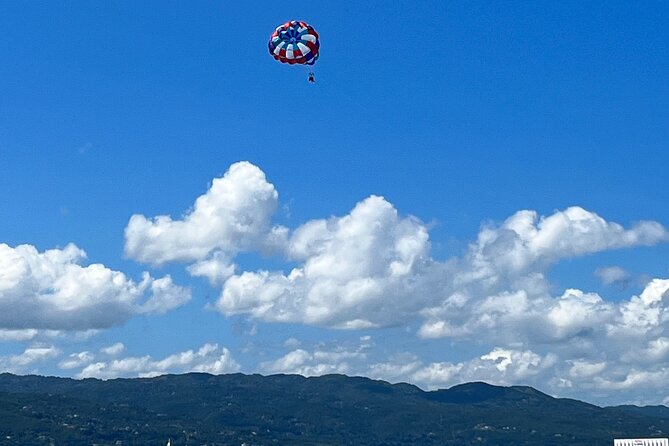 Parasailing above Turquoise Ocean Waters in Montego Bay - Beach Time After You Come Down