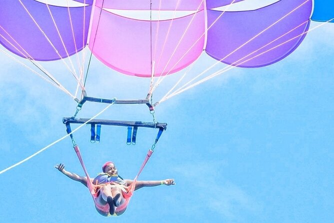 Parasailing, Blue Hole Mineral Spring, Seven Mile Beach - The guides can shape the day