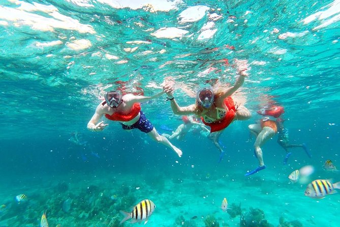 Party Catamaran: OpenBar, Music, Negril Beach, Caves, Snorkeling - Arriving at Margaritaville and 7 Mile Beach