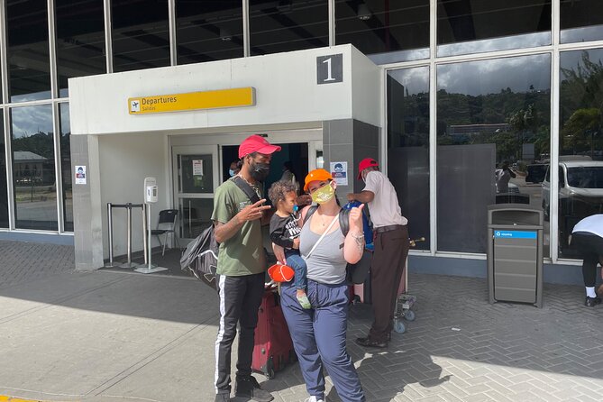 Private Round-Trip Airport Transportation to Negril from MBJ - Local stops at the Negril sign and a Jamaican shop