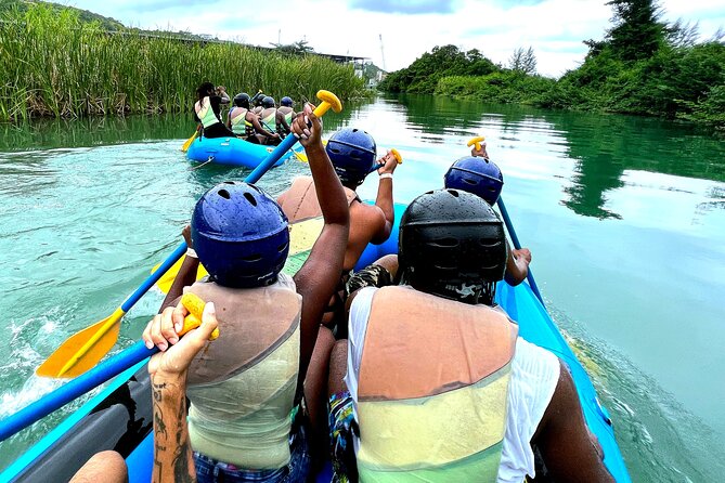 River Rapids Waterfalls Tubing and Beach Adventure with Transport - Switching from tubes to a raft